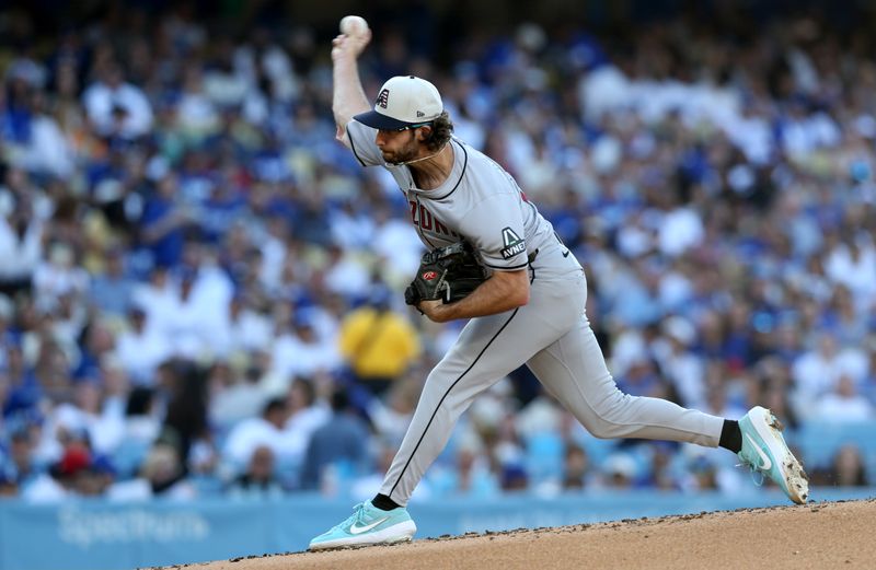 Jul 4, 2024; Los Angeles, California, USA; Arizona Diamondbacks pitcher Zac Gallen (23) throws during the first inning against the Los Angeles Dodgers at Dodger Stadium. Mandatory Credit: Jason Parkhurst-USA TODAY Sports