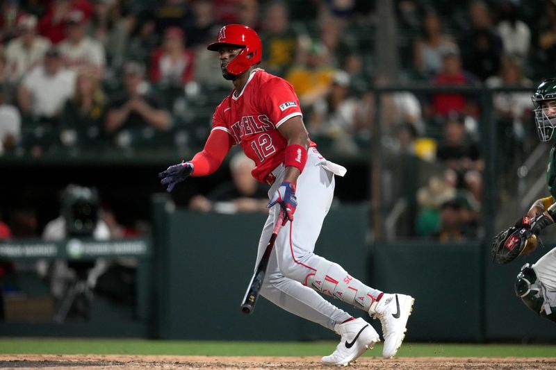 May 21, 2025; West Sacramento, Los Angeles Angels designated hitter Jorge Soler (12) hits a RBI double against the Athletics in the eighth inning at Sutter Health Park. Mandatory Credit: Cary Edmondson-Imagn Images