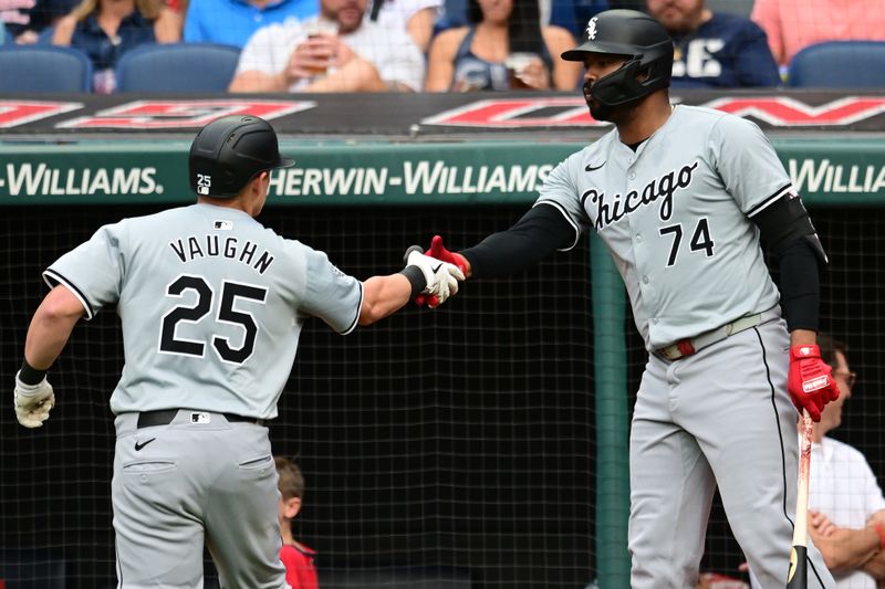 Jul 2, 2024; Cleveland, Ohio, USA; Chicago White Sox first baseman Andrew Vaughn (25) celebrates with designated hitter Eloy Jimenez (74) after hitting a home run during the first inning against the Cleveland Guardians at Progressive Field. Mandatory Credit: Ken Blaze-USA TODAY Sports