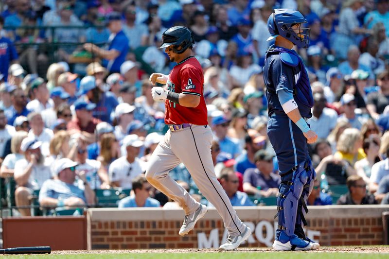 Jul 19, 2024; Chicago, Illinois, USA; Arizona Diamondbacks catcher Gabriel Moreno (14) scores against the Chicago Cubs during the fifth inning at Wrigley Field. Mandatory Credit: Kamil Krzaczynski-USA TODAY Sports