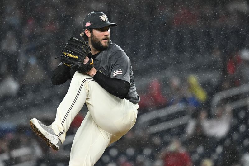 Sep 27, 2024; Washington, District of Columbia, USA;  Washington Nationals pitcher Trevor Williams (32) delivers a pitch during the fifth inning against the Philadelphia Phillies at Nationals Park. Mandatory Credit: James A. Pittman-Imagn Images