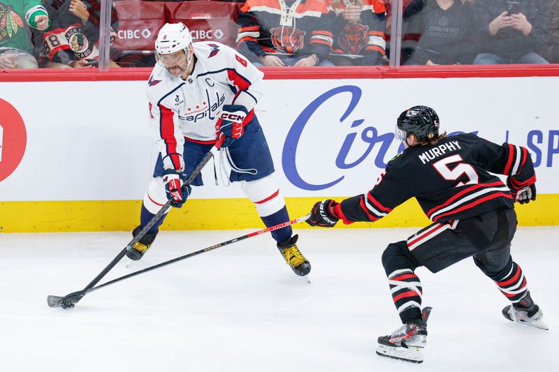 Jan 9, 2026; Chicago, Illinois, USA; Chicago Blackhawks defenseman Connor Murphy (5) defends against Washington Capitals left wing Alex Ovechkin (8) during the first period at United Center. Mandatory Credit: Kamil Krzaczynski-Imagn Images