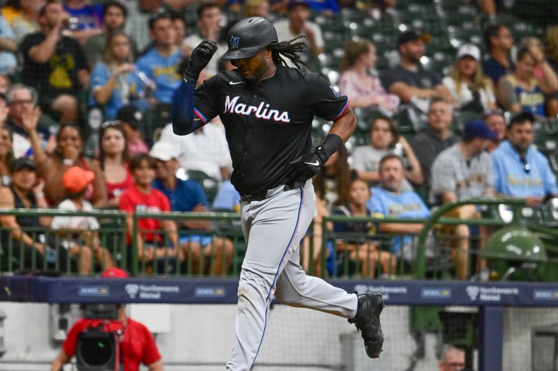 Jul 26, 2024; Milwaukee, Wisconsin, USA; Miami Marlins first baseman Josh Bell (9) runs the bases after hitting a solo home run in the ninth inning against the Milwaukee Brewers at American Family Field. Mandatory Credit: Benny Sieu-USA TODAY Sports