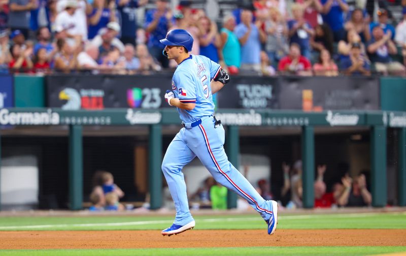 May 19, 2024; Arlington, Texas, USA; Texas Rangers shortstop Corey Seager (5) runs the bases after hitting a home run during the fourth inning against the Los Angeles Angels at Globe Life Field. Mandatory Credit: Kevin Jairaj-USA TODAY Sports
