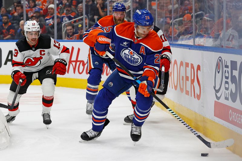 Nov 4, 2024; Edmonton, Alberta, CAN; Edmonton Oilers defensemen Darnell Nurse (25) clears the puck in front of New Jersey Devils forward Nico Hischier (13) and forward Stefan Noesen (11) during the second period at Rogers Place. Mandatory Credit: Perry Nelson-Imagn Images