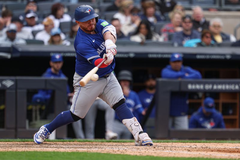 Apr 27, 2025; Bronx, New York, USA; Toronto Blue Jays catcher Alejandro Kirk (30) singles during the eighth inning against the New York Yankees at Yankee Stadium. Mandatory Credit: Vincent Carchietta-Imagn Images