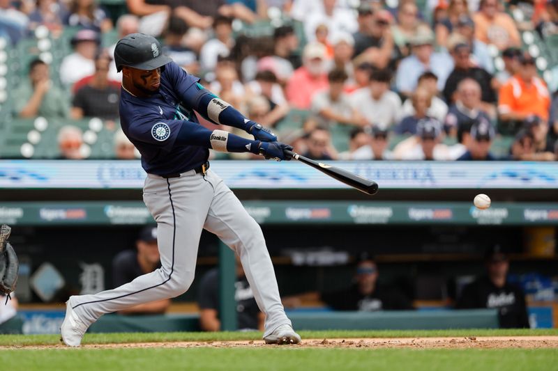 Aug 15, 2024; Detroit, Michigan, USA;  Seattle Mariners outfielder Victor Robles (10) hits a double against the Detroit Tigers in the fifth inning at Comerica Park. Mandatory Credit: Rick Osentoski-USA TODAY Sports