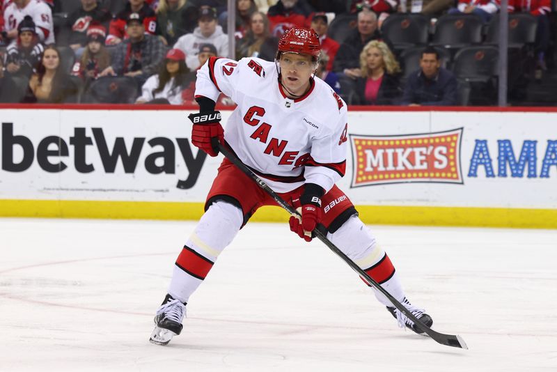 Mar 9, 2024; Newark, New Jersey, USA; Carolina Hurricanes center Evgeny Kuznetsov (92) against the New Jersey Devils during the first period at Prudential Center. Mandatory Credit: Ed Mulholland-USA TODAY Sports