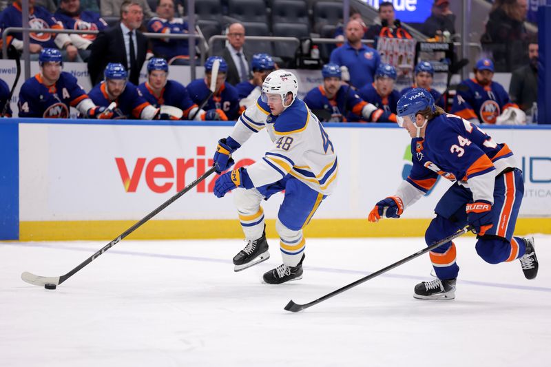 Jan 24, 2026; Elmont, New York, USA; Buffalo Sabres center Tyson Kozak (48) skates with the puck against New York Islanders defenseman Adam Boqvist (34) during the first period at UBS Arena. Mandatory Credit: Brad Penner-Imagn Images Jan 24, 2026; Elmont, New York, USA; Buffalo Sabres center Tyson Kozak (48) skates with the puck against New York Islanders defenseman Adam Boqvist (34) during the first period at UBS Arena. Mandatory Credit: Brad Penner-Imagn Images