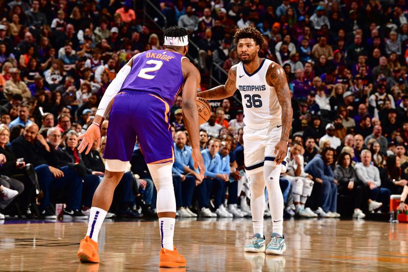 PHOENIX, AZ - JANUARY 7: Marcus Smart #36 of the Memphis Grizzlies dribbles the ball during the game against the Phoenix Suns on January 7, 2024 at Footprint Center in Phoenix, Arizona. NOTE TO USER: User expressly acknowledges and agrees that, by downloading and or using this photograph, user is consenting to the terms and conditions of the Getty Images License Agreement. Mandatory Copyright Notice: Copyright 2024 NBAE (Photo by Barry Gossage/NBAE via Getty Images)