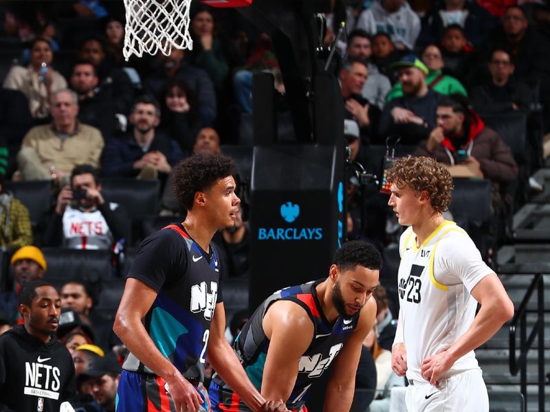 BROOKLYN, NY - JANUARY 29: Cameron Johnson #2 and Ben Simmons #10 help up Lonnie Walker IV #8 of the Brooklyn Nets during the game against the Utah Jazz on January 29, 2024 at Barclays Center in Brooklyn, New York. NOTE TO USER: User expressly acknowledges and agrees that, by downloading and or using this Photograph, user is consenting to the terms and conditions of the Getty Images License Agreement. Mandatory Copyright Notice: Copyright 2024 NBAE (Photo by David L. Nemec/NBAE via Getty Images)