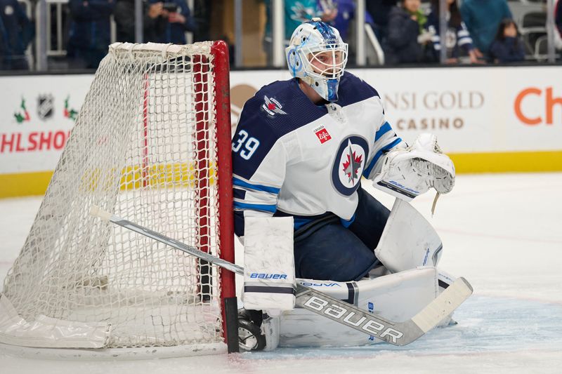 Dec 12, 2023; San Jose, California, USA; Winnipeg Jets goaltender Laurent Brossoit (39) tends goal during warmups before the game between the San Jose Sharks and the Winnipeg Jets at SAP Center at San Jose. Mandatory Credit: Robert Edwards-USA TODAY Sports