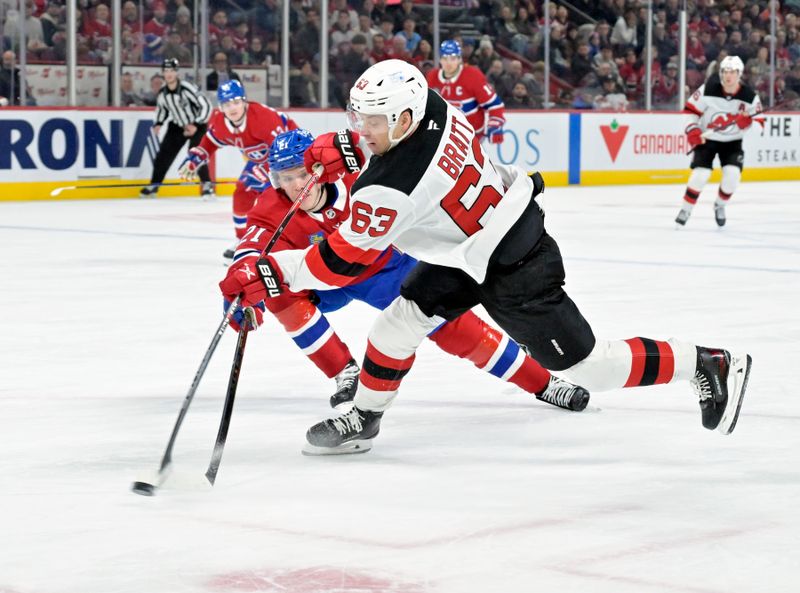 Jan 25, 2025; Montreal, Quebec, CAN; New Jersey Devils forward Jesper Bratt (63) takes a shot on net against Montreal Canadiens defenseman Kaiden Guhle (21) during the third period at the Bell Centre. Mandatory Credit: Eric Bolte-Imagn Images