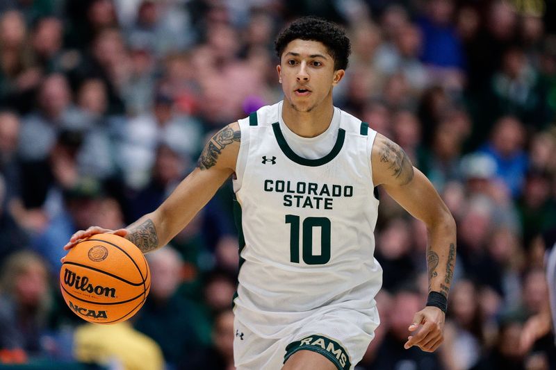 Feb 17, 2024; Fort Collins, Colorado, USA; Colorado State Rams guard Nique Clifford (10) dribbles the ball up court in the second half against the Utah State Aggies at Moby Arena. Mandatory Credit: Isaiah J. Downing-USA TODAY Sports