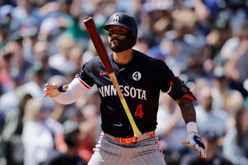 Jun 1, 2025; Seattle, Washington, USA; Minnesota Twins shortstop Carlos Correa (4) reacts after striking out during the eighth inning against the Seattle Mariners at T-Mobile Park. Mandatory Credit: John Froschauer-Imagn Images