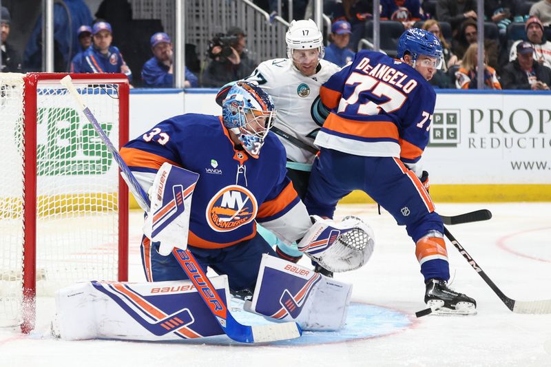 Nov 23, 2025; Elmont, New York, USA;  New York Islanders goaltender David Rittich (33) defends against a shot on goal in the second period against the Seattle Kraken at UBS Arena. Mandatory Credit: Wendell Cruz-Imagn Images