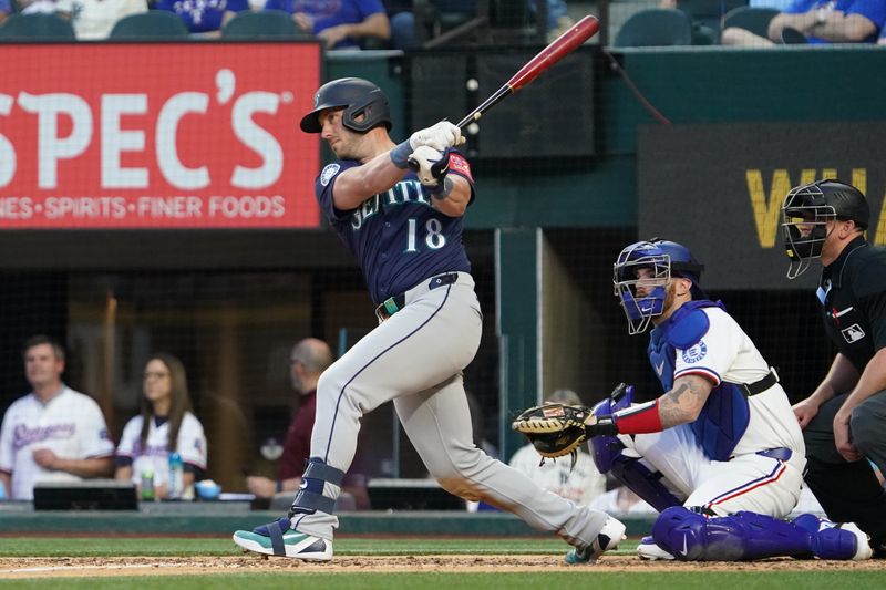 May 3, 2025; Arlington, Texas, USA; Seattle Mariners catcher Mitch Garver (18) hits a single during the sixth inning against the Texas Rangers at Globe Life Field. Mandatory Credit: Raymond Carlin III-Imagn Images