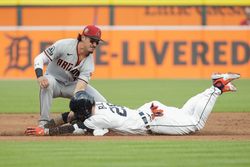 Jun 9, 2023; Detroit, Michigan, USA; Arizona Diamondbacks shortstop Josh Rojas (10) tags out Detroit Tigers Javier B ez (28) at third base during the first inning at Comerica Park. Mandatory Credit: Brian Bradshaw Sevald-USA TODAY Sports