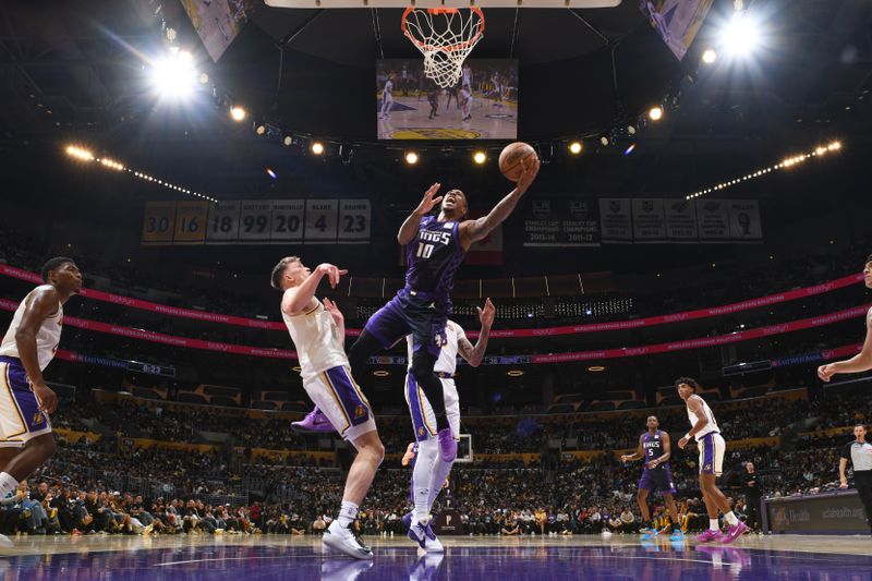 LOS ANGELES, CA - OCTOBER 26: DeMar DeRozan #10 of the Sacramento Kings drives to the basket during the game against the Los Angeles Lakers on October 26, 2024 at Crypto.Com Arena in Los Angeles, California. NOTE TO USER: User expressly acknowledges and agrees that, by downloading and/or using this Photograph, user is consenting to the terms and conditions of the Getty Images License Agreement. Mandatory Copyright Notice: Copyright 2024 NBAE (Photo by Adam Pantozzi/NBAE via Getty Images)