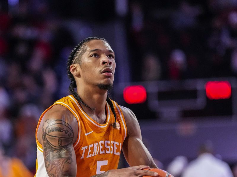 Jan 13, 2024; Athens, Georgia, USA; Tennessee Volunteers guard Zakai Zeigler (5) shoots a free throw against the Georgia Bulldogs during the first half at Stegeman Coliseum. Mandatory Credit: Dale Zanine-USA TODAY Sports