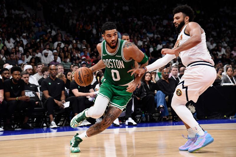 ABU DHABI, UAE - OCTOBER 6: Jayson Tatum #0 of the Boston Celtics dribbles the ball during the game against the Denver Nuggets during the 2024 Global Games on October 6, 2024 at the Etihad Arena in Abu Dhabi, United Arab Emirates. NOTE TO USER: User expressly acknowledges and agrees that, by downloading and/or using this Photograph, user is consenting to the terms and conditions of the Getty Images License Agreement. Mandatory Copyright Notice: Copyright 2024 NBAE (Photo by Brian Babineau/NBAE via Getty Images)