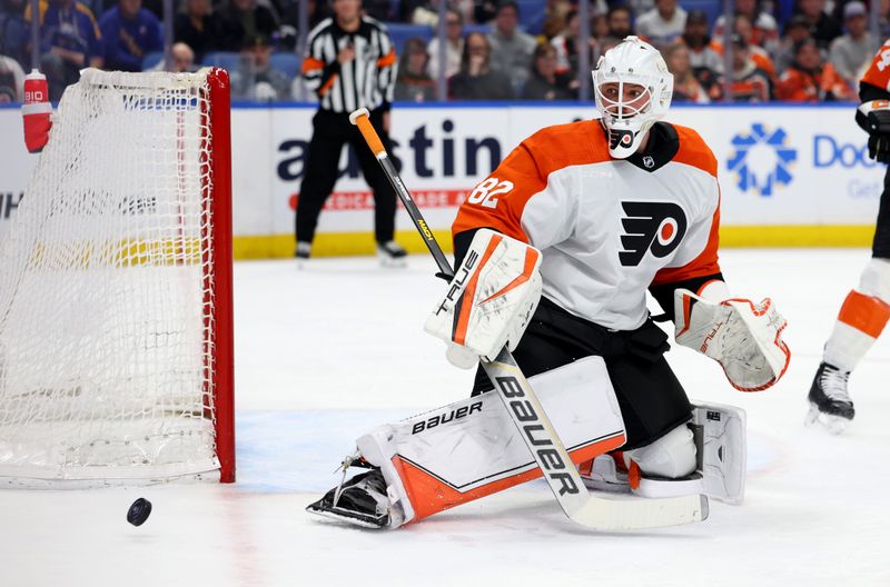 Apr 5, 2024; Buffalo, New York, USA;  Philadelphia Flyers goaltender Ivan Fedotov (82) watches the puck during the second period against the Buffalo Sabres at KeyBank Center. Mandatory Credit: Timothy T. Ludwig-USA TODAY Sports