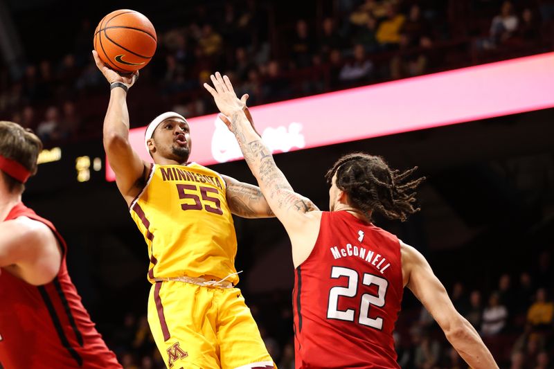 Mar 2, 2023; Minneapolis, Minnesota, USA; Minnesota Golden Gophers guard Ta'lon Cooper (55) shoots while Rutgers Scarlet Knights guard Caleb McConnell (22) defends during the first half at Williams Arena. Mandatory Credit: Matt Krohn-USA TODAY Sports