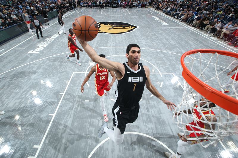 MEMPHIS, TN - MARCH 8: Santi Aldama #7 of the Memphis Grizzlies dunks the ball during the game against the Atlanta Hawks on March 8, 2024 at FedExForum in Memphis, Tennessee. NOTE TO USER: User expressly acknowledges and agrees that, by downloading and or using this photograph, User is consenting to the terms and conditions of the Getty Images License Agreement. Mandatory Copyright Notice: Copyright 2024 NBAE (Photo by Joe Murphy/NBAE via Getty Images)