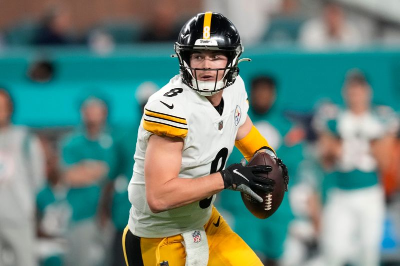 Pittsburgh Steelers quarterback Kenny Pickett (8) aims a pass during the first half of an NFL football game against the Miami Dolphins, Sunday, Oct. 23, 2022, in Miami Gardens, Fla. (AP Photo/Rebecca Blackwell)