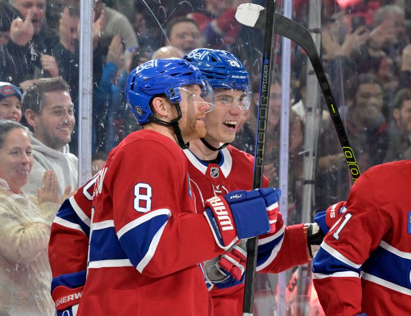 Mar 3, 2025; Montreal, Quebec, CAN; Montreal Canadiens defenseman Mike Matheson (8) celebrates with teammate forward Juraj Slafkovsky (20) after scoring the game winning goal against the Buffalo Sabres during the overtime period at the Bell Centre. Mandatory Credit: Eric Bolte-Imagn Images