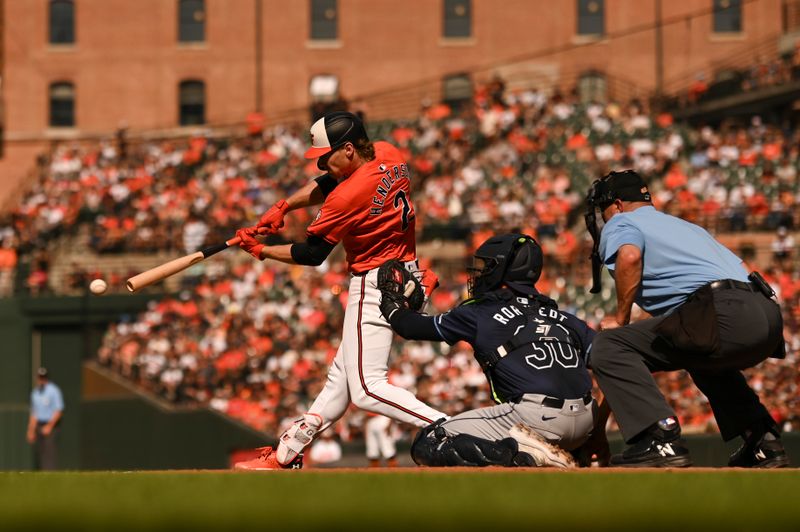 Jun 1, 2024; Baltimore, Maryland, USA; Baltimore Orioles shortstop Gunnar Henderson (2) this a second inning single against the Tampa Bay Rays  at Oriole Park at Camden Yards. Mandatory Credit: Tommy Gilligan-USA TODAY Sports