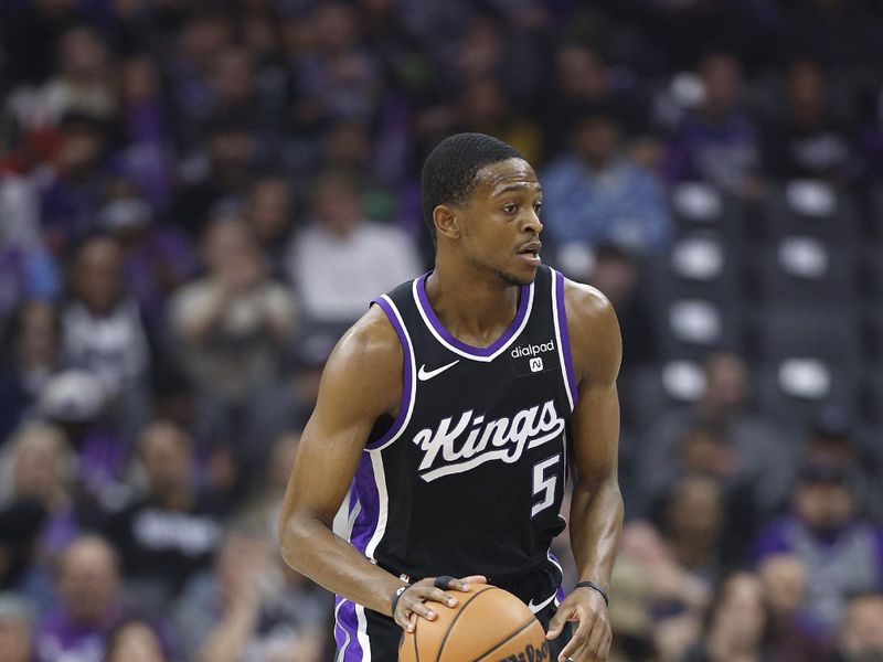 SACRAMENTO, CALIFORNIA - JANUARY 03: De'Aaron Fox #5 of the Sacramento Kings dribbles the ball up court against the Orlando Magic during the first half of an NBA basketball game at Golden 1 Center on January 03, 2024 in Sacramento, California. NOTE TO USER: User expressly acknowledges and agrees that, by downloading and or using this photograph, User is consenting to the terms and conditions of the Getty Images License Agreement. (Photo by Thearon W. Henderson/Getty Images)