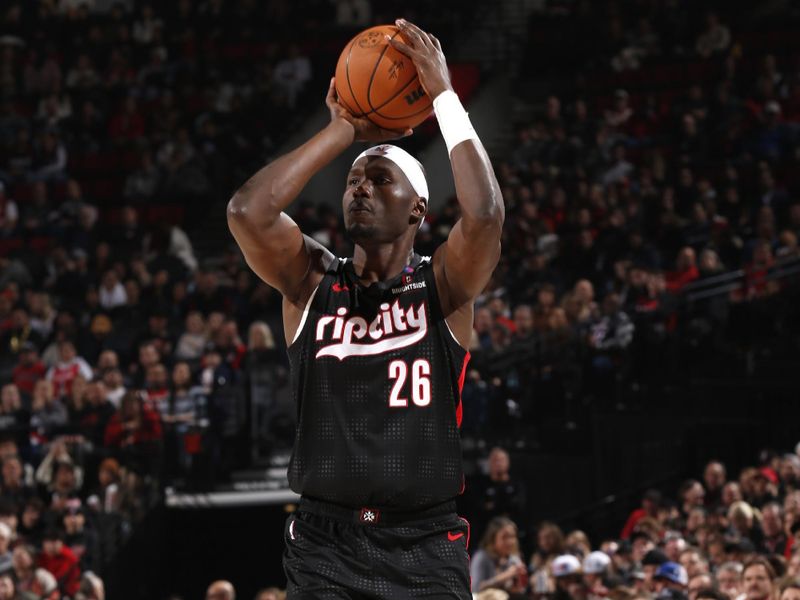 PORTLAND, OR - JANUARY 11: Duop Reath #26 of the Portland Trail Blazers shoots the ball during the game against the Miami Heat   on January 11, 2025 at the Moda Center Arena in Portland, Oregon. NOTE TO USER: User expressly acknowledges and agrees that, by downloading and or using this photograph, user is consenting to the terms and conditions of the Getty Images License Agreement. Mandatory Copyright Notice: Copyright 2025 NBAE (Photo by Cameron Browne/NBAE via Getty Images)