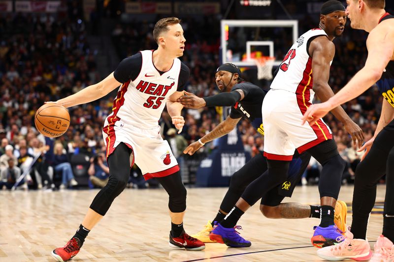 DENVER, COLORADO - FEBRUARY 29: Duncan Robinson #55 of the Miami Heat drives against the Denver Nuggets at Ball Arena on February 29, 2024 in Denver, Colorado. NOTE TO USER: User expressly acknowledges and agrees that, by downloading and/or using this Photograph, user is consenting to the terms and conditions of the Getty Images License Agreement. (Photo by Jamie Schwaberow/Getty Images)