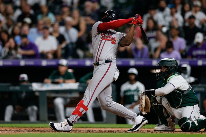 Aug 10, 2024; Denver, Colorado, USA; Atlanta Braves right fielder Jorge Soler (2) hits a solo home run in the eighth inning against the Colorado Rockies at Coors Field. Mandatory Credit: Isaiah J. Downing-USA TODAY Sports