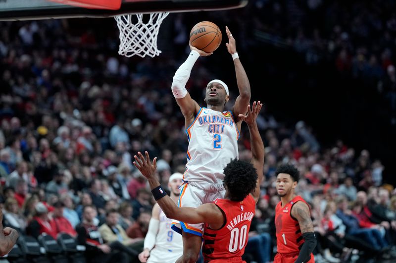 PORTLAND, OREGON - JANUARY 26: Shai Gilgeous-Alexander #2 of the Oklahoma City Thunder shoots the ball over Scoot Henderson #00 of the Portland Trail Blazers during the first half at Moda Center on January 26, 2025 in Portland, Oregon. NOTE TO USER: User expressly acknowledges and agrees that, by downloading and or using this photograph, User is consenting to the terms and conditions of the Getty Images License Agreement. (Photo by Soobum Im/Getty Images)