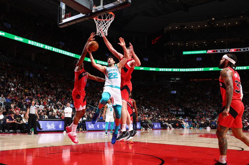 TORONTO, CANADA - MARCH 3: Vasilije Micic #22 of the Charlotte Hornets drives to the basket during the game against the Toronto Raptors on March 3, 2024 at the Scotiabank Arena in Toronto, Ontario, Canada.  NOTE TO USER: User expressly acknowledges and agrees that, by downloading and or using this Photograph, user is consenting to the terms and conditions of the Getty Images License Agreement.  Mandatory Copyright Notice: Copyright 2024 NBAE (Photo by Vaughn Ridley/NBAE via Getty Images)