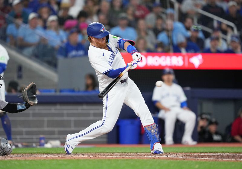 Jun 30, 2024; Toronto, Ontario, CAN; Toronto Blue Jays designated hitter Justin Turner (2) hits a single against the New York Yankees during the third inning at Rogers Centre. Mandatory Credit: Nick Turchiaro-USA TODAY Sports