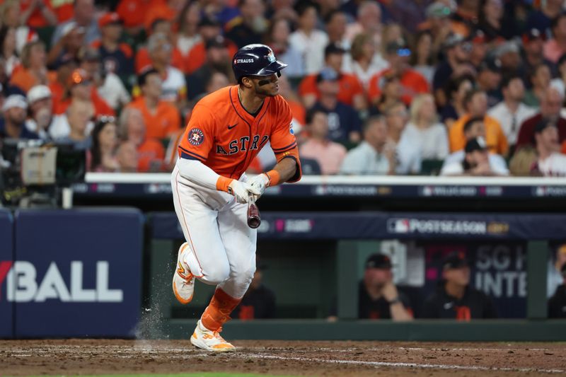 Oct 2, 2024; Houston, Texas, USA; Houston Astros shortstop Jeremy Pena (3) hits a single against the Detroit Tigers during the seventh inning of game two of the Wildcard round for the 2024 MLB Playoffs at Minute Maid Park. Mandatory Credit: Thomas Shea-Imagn Images