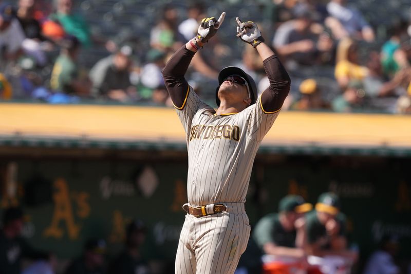 Sep 17, 2023; Oakland, California, USA; San Diego Padres left fielder Juan Soto (22) gestures after hitting a home run against the Oakland Athletics during the seventh inning at Oakland-Alameda County Coliseum. Mandatory Credit: Darren Yamashita-USA TODAY Sports