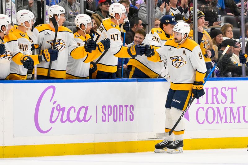 Dec 15, 2025; St. Louis, Missouri, USA; Nashville Predators left wing Filip Forsberg (9) is congratulated by teammates after scoring against the St. Louis Blues during the second period at Enterprise Center. Mandatory Credit: Jeff Curry-Imagn Images