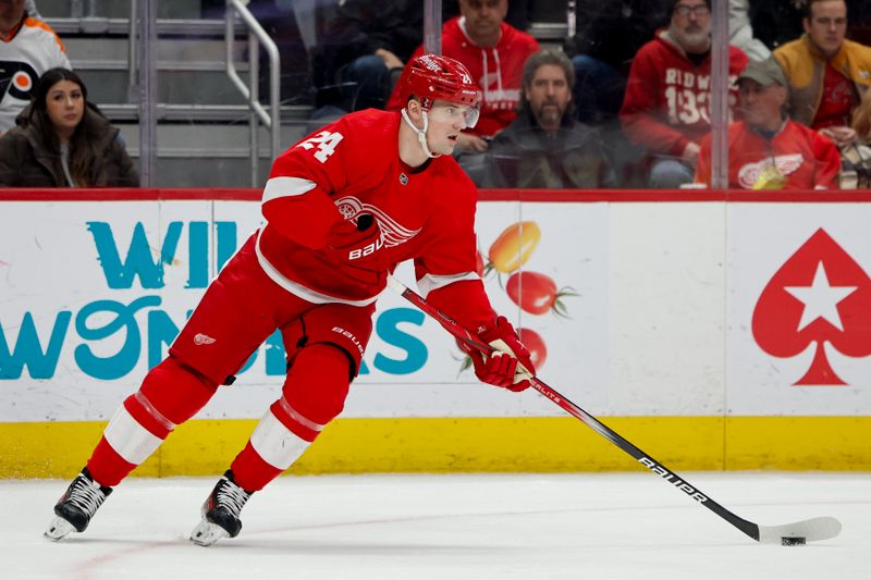 Jan 25, 2024; Detroit, Michigan, USA;  Detroit Red Wings center Klim Kostin (24) skates with the puck in the first period against the Philadelphia Flyers at Little Caesars Arena. Mandatory Credit: Rick Osentoski-USA TODAY Sports