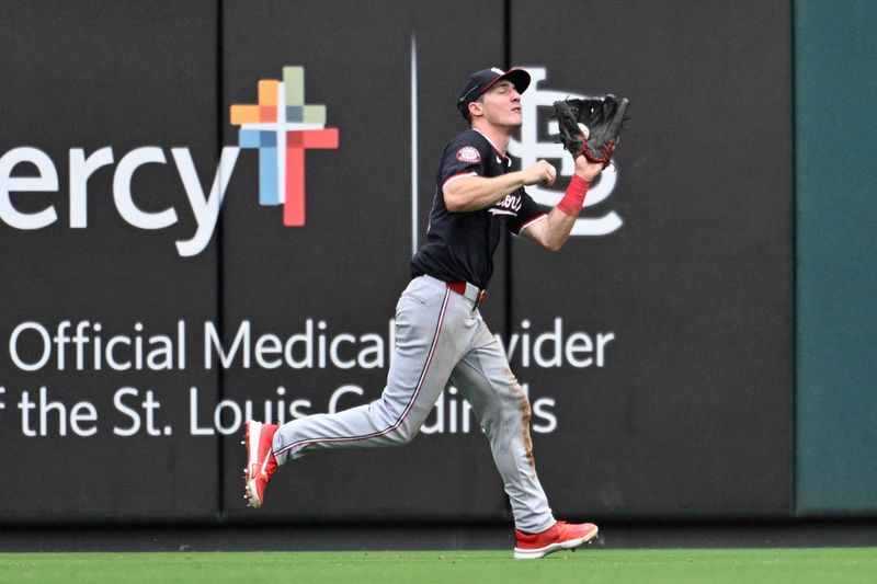 Jul 28, 2024; St. Louis, Missouri, USA; Washington Nationals center fielder Jacob Young (30) makes the catch on a fly ball from St. Louis Cardinals third baseman Nolan Arenado (28) during the eighth inning at Busch Stadium. Mandatory Credit: Jeff Le-USA TODAY Sports