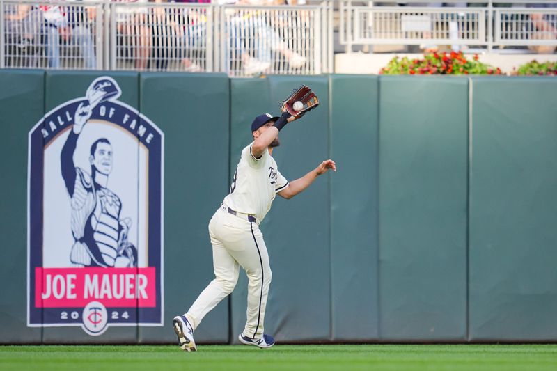 May 6, 2024; Minneapolis, Minnesota, USA; Minnesota Twins outfielder Alex Kirilloff (19) fields a fly ball against the Seattle Mariners in the third inning at Target Field. Mandatory Credit: Brad Rempel-USA TODAY Sports