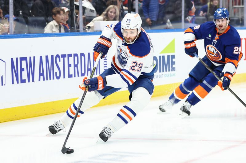 Oct 16, 2025; Elmont, New York, USA; Edmonton Oilers center Leon Draisaitl (29) controls the puck in the first period against the New York Islanders at UBS Arena. Mandatory Credit: Wendell Cruz-Imagn Images