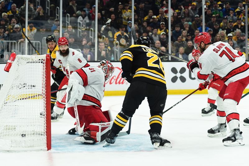 Apr 5, 2025; Boston, Massachusetts, USA; Boston Bruins center Elias Lindholm (28) scores a goal past Carolina Hurricanes goaltender Frederik Andersen (31) during the first period at TD Garden. Mandatory Credit: Bob DeChiara-Imagn Images