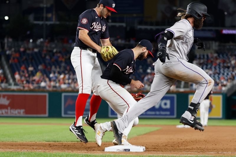 Aug 21, 2024; Washington, District of Columbia, USA; Washington Nationals first baseman Joey Gallo (24) tags first base after fielding a ground ball by Colorado Rockies outfielder Charlie Blackmon (19) as Nationals pitcher Joe La Sorsa (53) leaps out of the way during the eighth inning at Nationals Park. Mandatory Credit: Geoff Burke-USA TODAY Sports