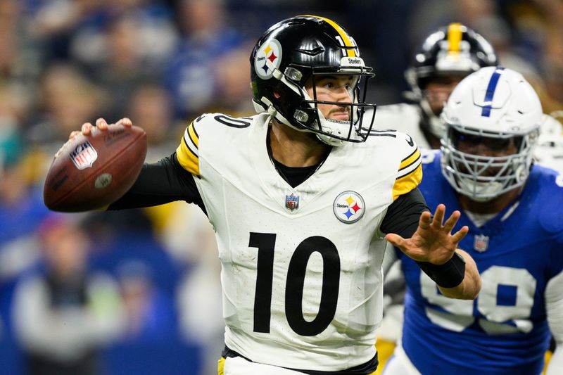 Pittsburgh Steelers quarterback Mitch Trubisky (10) gets pressure in the pocket during an NFL football game against the Indianapolis Colts, Saturday, Dec. 16, 2023, in Indianapolis. (AP Photo/Zach Bolinger)