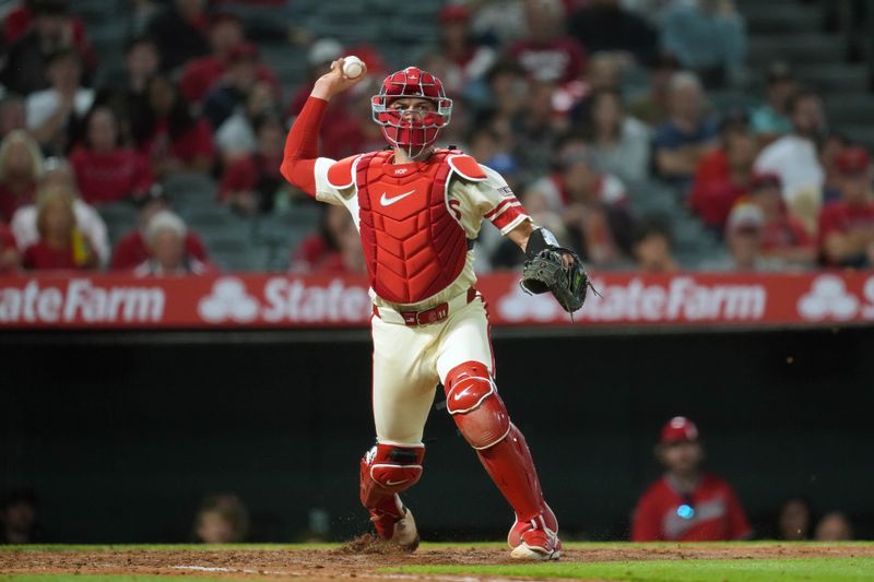 May 8, 2025; Anaheim, California, USA; Los Angeles Angels catcher Logan O'Hoppe (14) throws the ball in the sixth inning against the Toronto Blue Jays at Angel Stadium. Mandatory Credit: Kirby Lee-Imagn Images