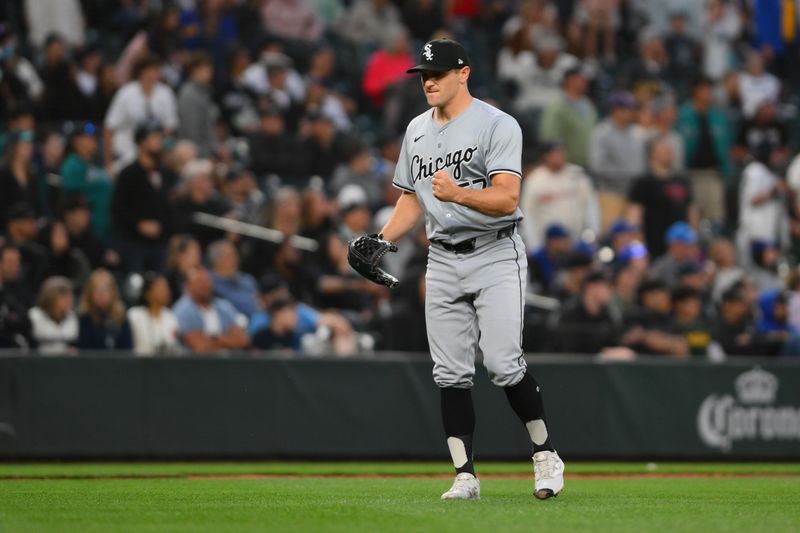 Jun 13, 2024; Seattle, Washington, USA; Chicago White Sox relief pitcher Tanner Banks (57) celebrates after the final out against the Seattle Mariners during the tenth inning at T-Mobile Park. Mandatory Credit: Steven Bisig-USA TODAY Sports